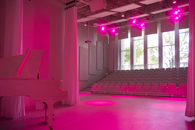 The white space offers a plain backdrop that can be washed in any color or design for different programming.